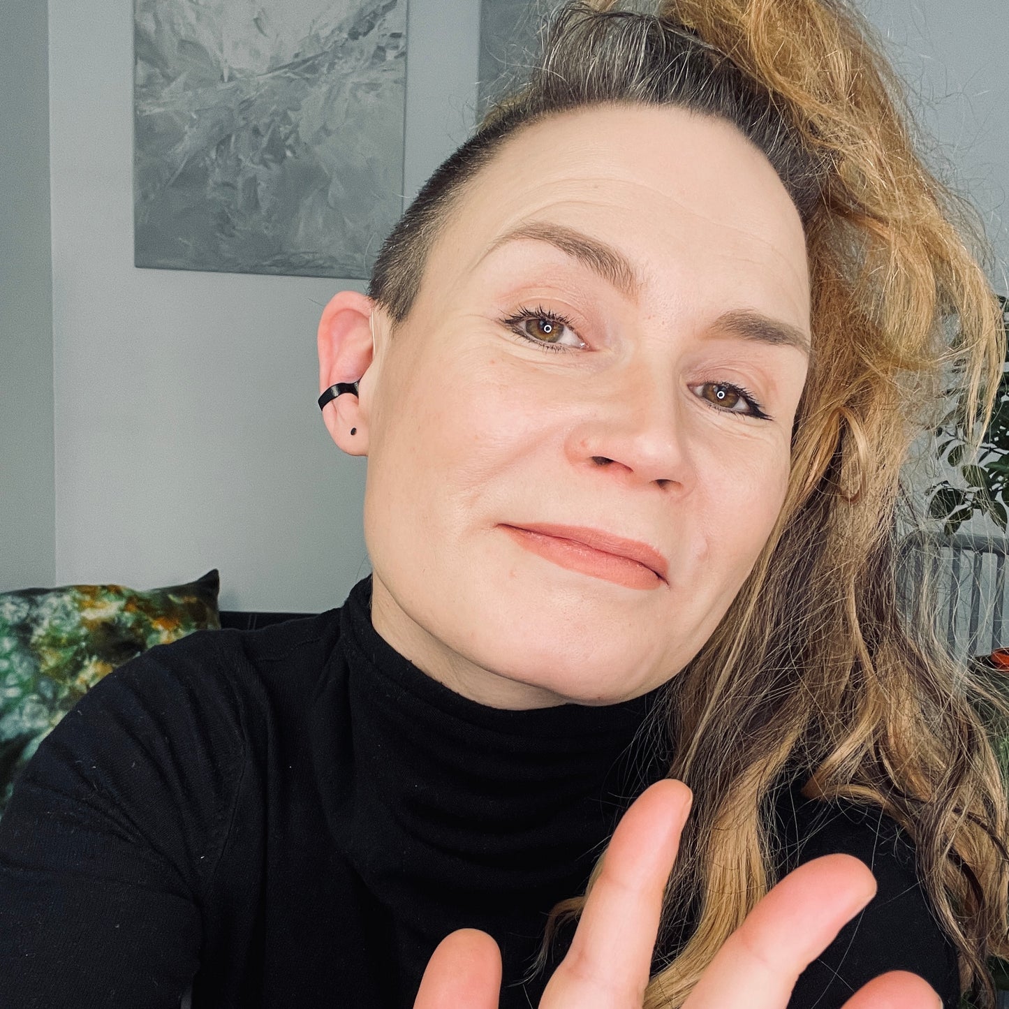 black Deafmetal insurance clip on a woman